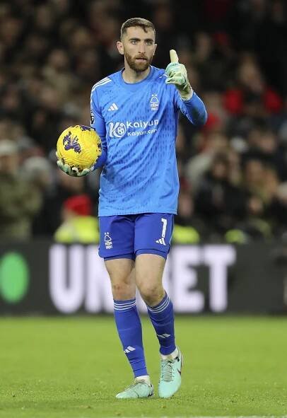 Matt Turner, Nottingham Forest goalkeeper, holding a soccer ball.