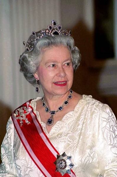 Queen Elizabeth II has worn the Belgian Sapphire tiara on several occasions, including a 1988 banquet at Prague Castle in the Czech Republic. Though most of Her Majesty's tiaras were inherited, few were purchased. This sapphire and diamond tiara formerly belonged to Princess Louise of Belgium, who married Prince Ferdinand Philipp of Saxe-Coburg and Gotha in 1875. She had numerous affairs, leading to the couple's divorce — which left her in such enormous debt that she had to sell her jewelry. Queen Elizabeth II bought one of the Princess' tiaras in the early 1950s.