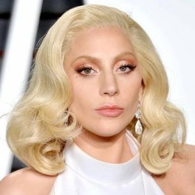 Lady Gaga with a platinum retro lob and rose gold makeup in 2016