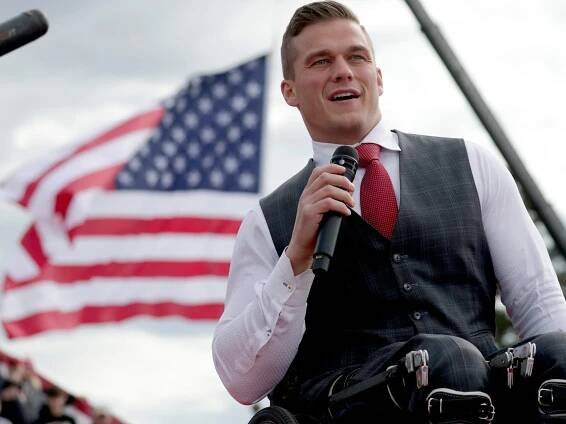 U.S. Rep. Madison Cawthorn, R-N.C., speaks to the crowd before former President Donald Trump takes the stage at a rally Saturday, April 9, 2022, in Selma, N.C.