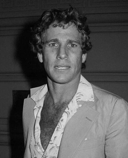 Ryan O'neal wearing open-neck shirt; circa 1970; New York