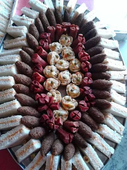 a platter filled with lots of different types of desserts on top of each other