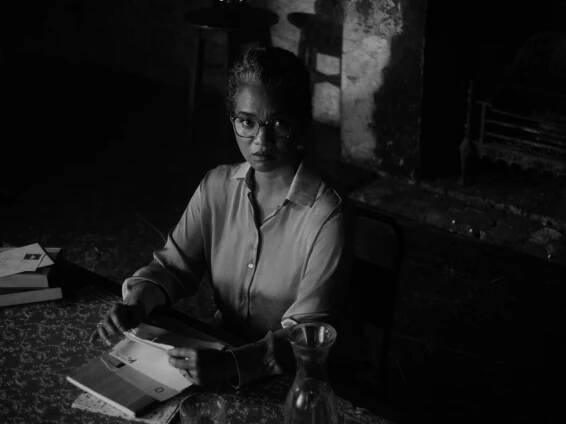 Chipo Chung reading Stone Yard Devotional by Charlotte Wood