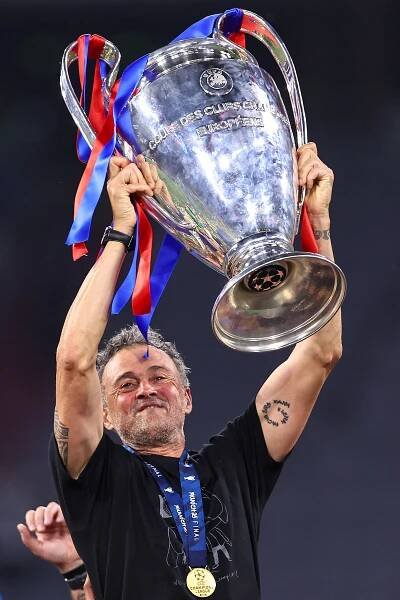 Luis Enrique lifting the UEFA Champions League trophy.