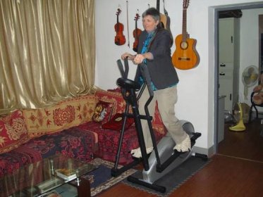 Ruth Anderson tries out the new elliptical trainer.  Jiangnan University,  Wuxi,  China  Note the classy runners.