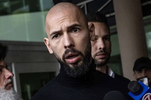 Andrew Tate (L) and Tristan Tate (R) arrive in the United States after a travel ban on them was lifted, at the Fort Lauderdale-Hollywood International Airport 