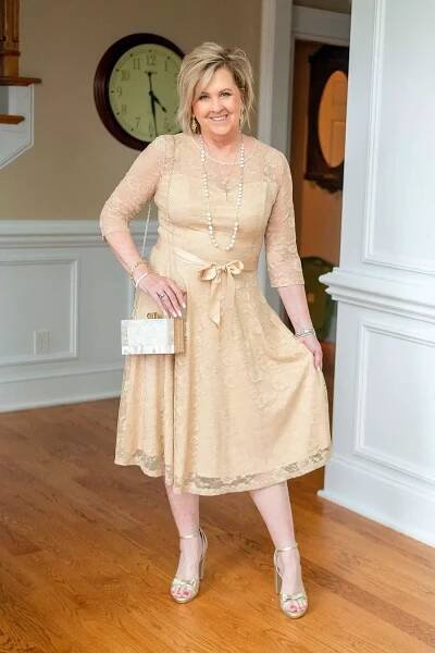 Fashion Blogger, Tania Stephens is wearing a champagne lace dress