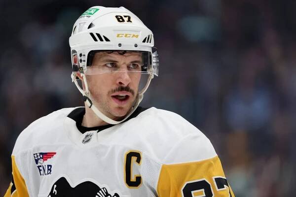 SEATTLE, WASHINGTON - JANUARY 25: Sidney Crosby #87 of the Pittsburgh Penguins looks on during the first period against the Seattle Kraken at Climate Pledge Arena on January 25, 2025 in Seattle, Washington. (Photo by Steph Chambers/Getty Images)