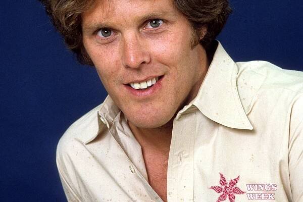 Actor Wings Hauser poses for a portrait in circa 1980. The Defector Wings Week logo is on his shirt.