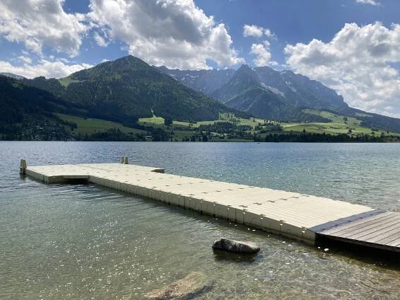 Walchsee lake with swim platform and beautiful mountain scenery