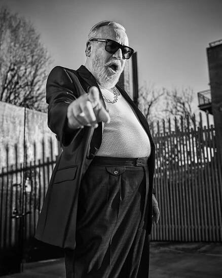 Ray wears Tux by Connoly, Vest by Marks and Spencer, Chain by Goosens, Glasses by Jaques Marie Mage // 📸 : Gavin Bond