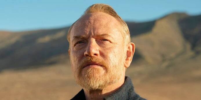 Jared Harris as Hari Seldon in looking at something in the distance in Foundation.