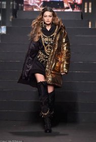 Chain of command: Sister Gigi looked glamorous in an oversized hoodie embroidered with chains and belts.