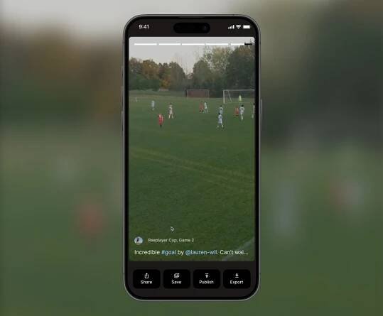 Three youth soccer players smiling while reviewing game footage on a smartphone, showcasing Reeplayer’s user-friendly mobile app