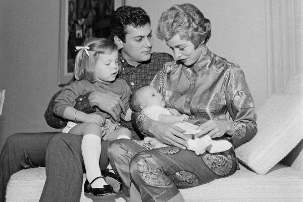 American actor Tony Curtis (1925 - 2010) with his wife, actress Janet Leigh (1927 - 2004) and their daughters Kelly Curtis and baby Jamie Lee Curtis, 1958.