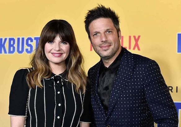 Casey Wilson and David Caspe attend the premiere of Netflix's 'Blockbuster' at the Netflix Tudum Theater on Oct. 27, 2022, in Los Angeles