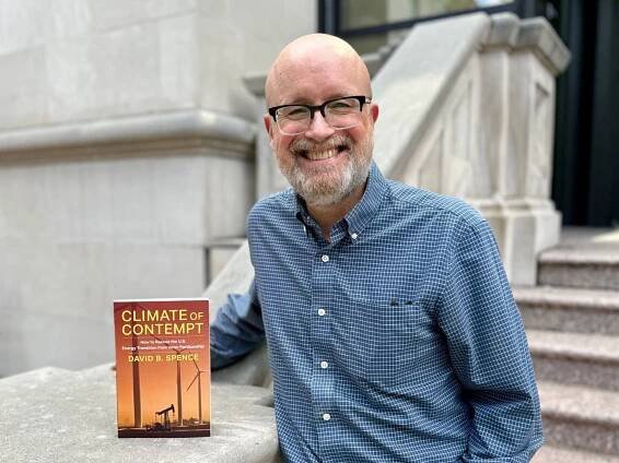 David Spence outside CCJ with his book