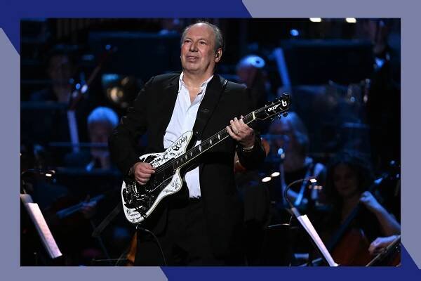 Hans Zimmer plays guitar in concert.