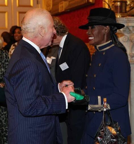 King Charles III talks with Grace Jones during a reception at St. James's Palace in London