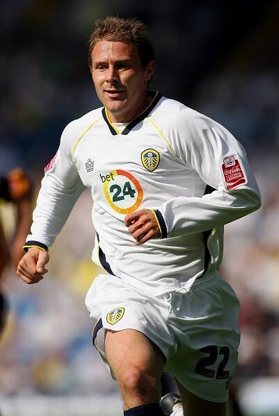 Ian Moore of Leeds United running during a soccer match.
