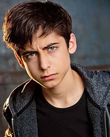 A Young Man In A Black Jacket And Black Pants Wallpaper