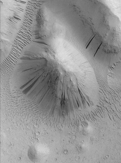 Sub-frame of MOC S13-00818, showing dark slope streaks and flow around obstacles.