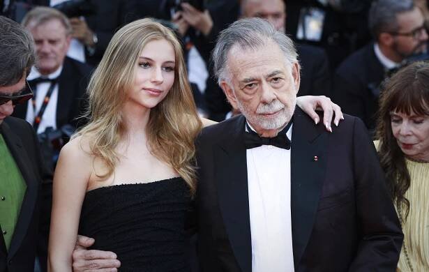 Romy Mars in a black strapless dress and Francis Ford Coppola in a tuxedo at the premiere of Megalopolis at the Cannes Film Festival in May 2024.