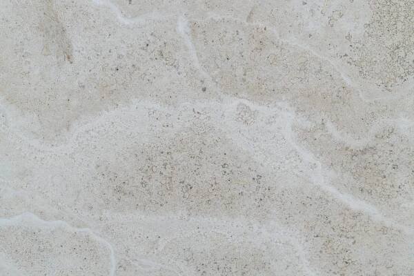a close up of a white marble surface