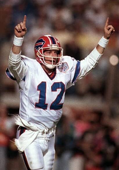 Jim Kelly, Buffalo Bills quarterback, celebrating a touchdown.