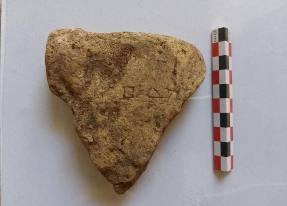 Fragment of a tile, with an engraved votive inscription to Odysseus, Hellenistic period