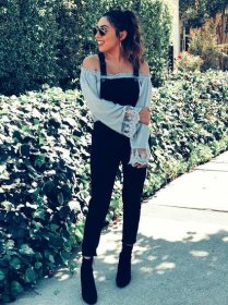 Fashion Blogger Alexis Alcala wearing Forever 21 overalls, Steve Madden boots and tobi off shoulder top during the fall 