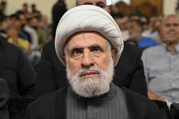 Naim Qassem is seen from the front.