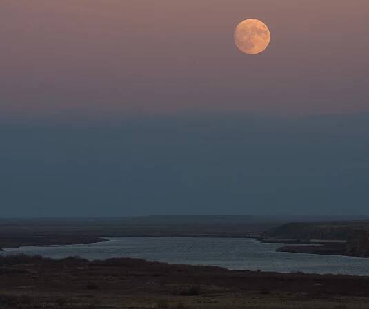 The nearly full supermoon Beaver Moon rises over the Syr Darya river near the Baikonur Cosmodrome spaceport in Kazakhstan on Nov. 13, 2016 in this view by NASA photographer Bill Ingalls.