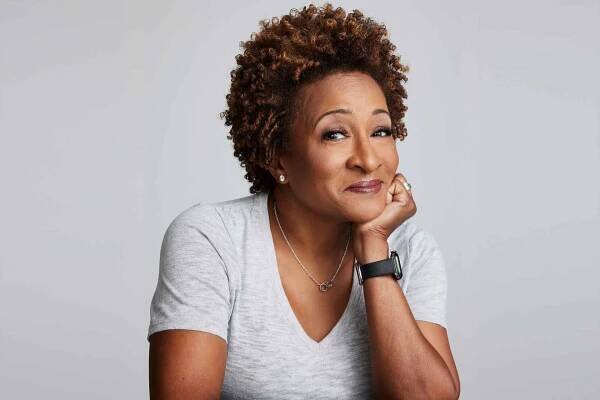 Photo of Wanda Sykes resting her head on her arm 