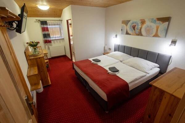 Postel nebo postele na pokoji v ubytování Wellness & Restaurant U Fandy