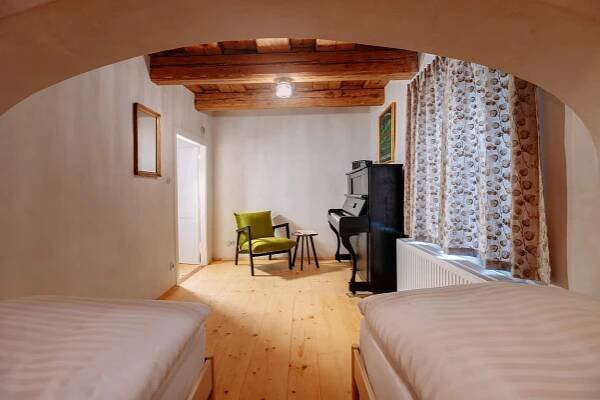 Postel nebo postele na pokoji v ubytování Apartmány Nathan - Ubytování s příběhem