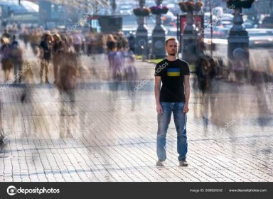 Young Ukrainian Man Stands Middle Crowded Street — Photo de stock par ©DPimage - 598824242