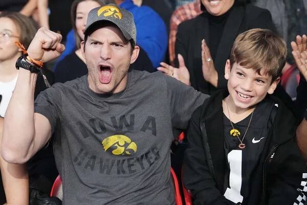 Ashton Kutcher and 8-Year-Old Son Dimitri Cheer Together at Los Angeles WWE Event in Rare Photos