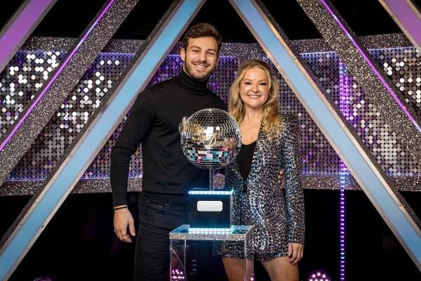 Sarah Hadland and Vito Coppola, Strictly Come Dancing 2024 finalists, with the glitterball trophy.