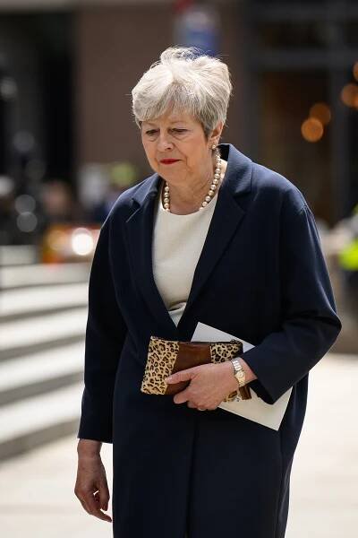 Theresa May departing after a memorial service.