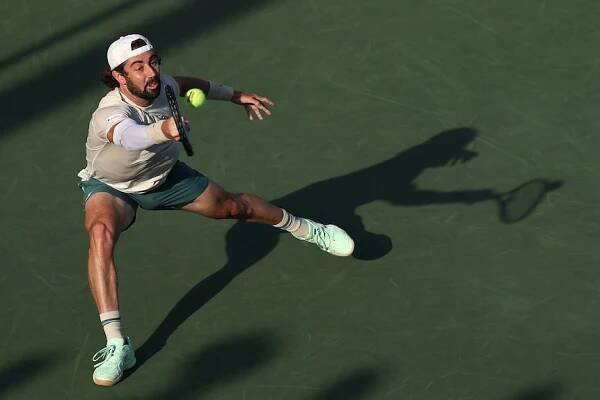 Jordan Thompson plays a forehand during a US Open match.