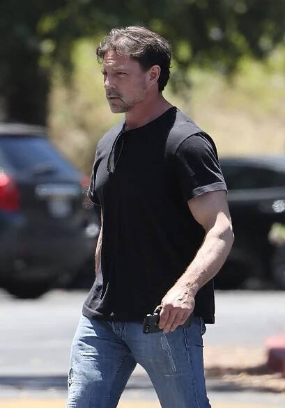 Aaron Phypers walking down the street.