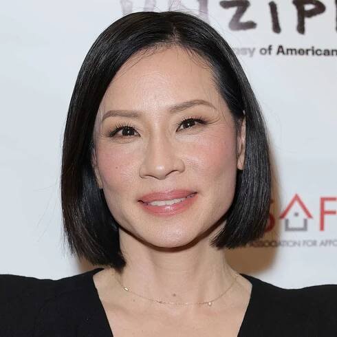 Lucy Liu wears a sleek bob hairstyle with side part