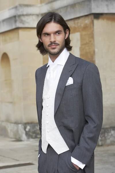 Grey herringbone light weight wool morning coat with matching grey herringbone trousers