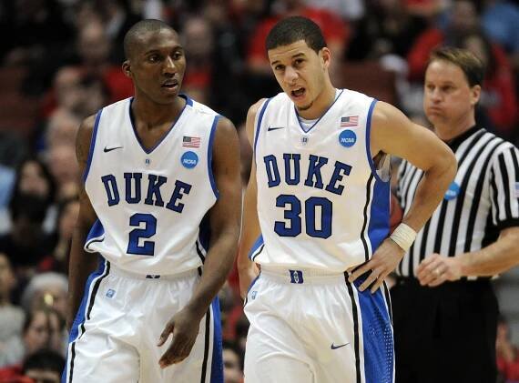 Duke captain Nolan Smith stands beside Seth Curry during the west regional semifinal of the 2011 NCAA Tournament