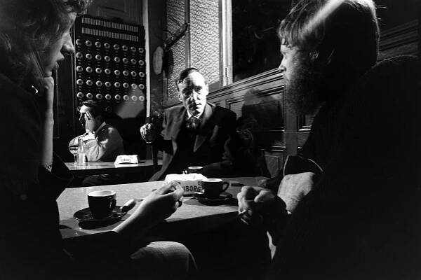 William S. Burroughs with unidentified companions in a Paris cafe, 1959.