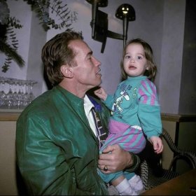 Childhood picture of Christina Schwarzenegger with her father