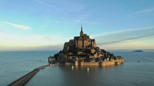 A scenic view of Mont-Saint-Michel at sunrise.