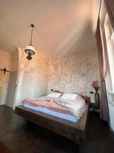 Postel nebo postele na pokoji v ubytování Apartmány v Podzámčí v blízkosti zámku Blatná