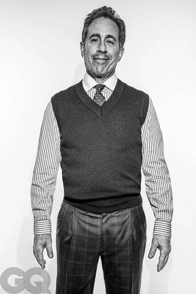 Image may contain Jerry Seinfeld Clothing Shirt Face Head Person Photography Portrait Vest Adult Happy and Smile